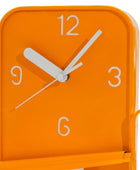 Orange clock with white numbers and hands on a white background