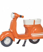 Orange scooter-shaped planter on a white background