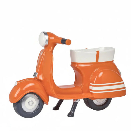 Orange scooter-shaped planter on a white background