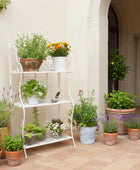 Potted plants on a white metal shelf against a beige wall.