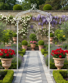 Garden pathway with decorative arch, potted plants, and flowers.