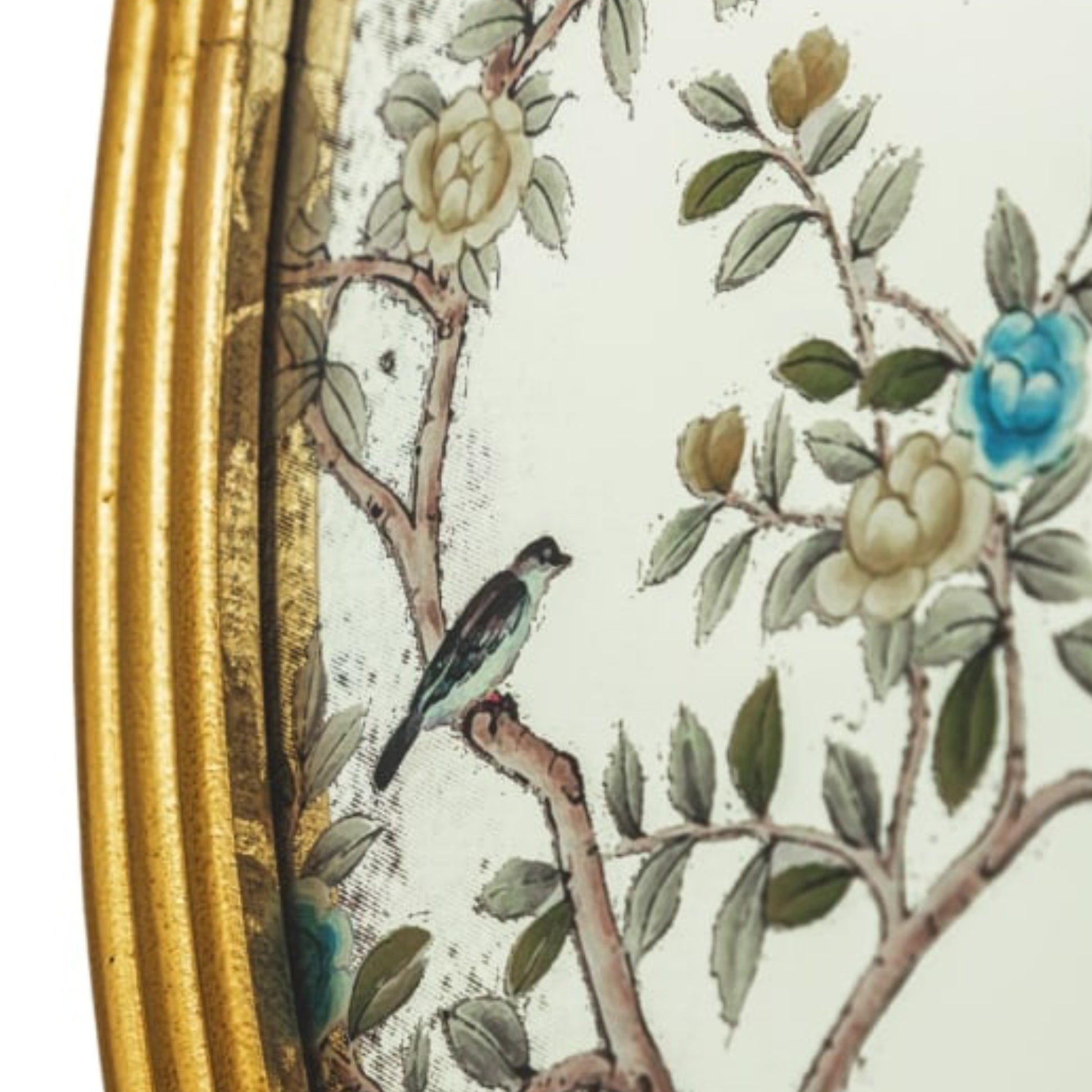 Decorative item with floral design and bird on a branch, gold frame on the left