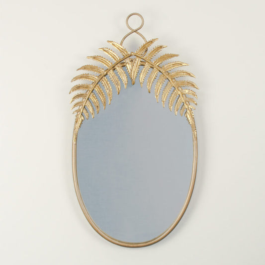 Decorative wall mirror with gold leaf design on a plain background