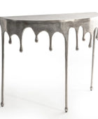 Metallic console table with a unique design on a white background