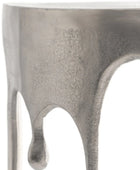 Close-up of a metallic object with a textured surface on a white background