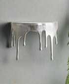Silver ring with a unique design on a white background