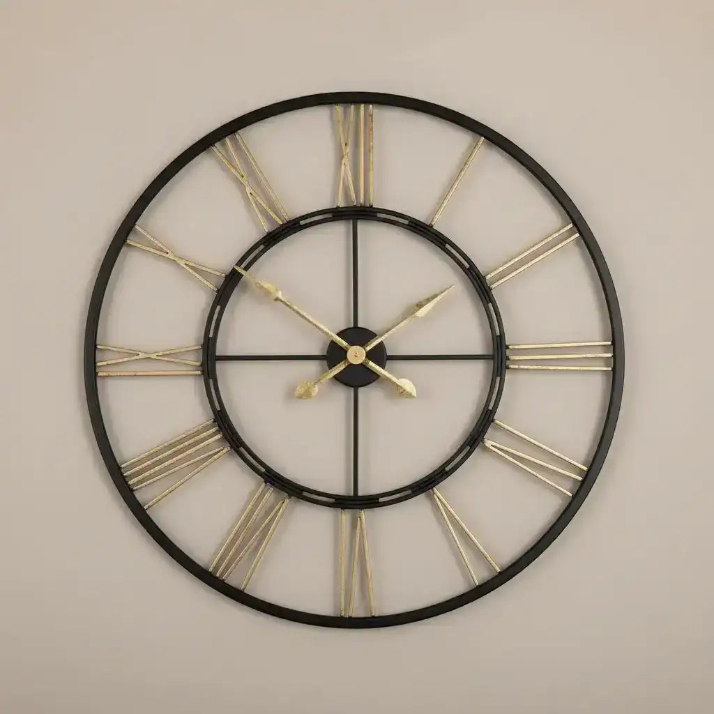 Decorative wall clock with black frame and gold Roman numerals on a white background