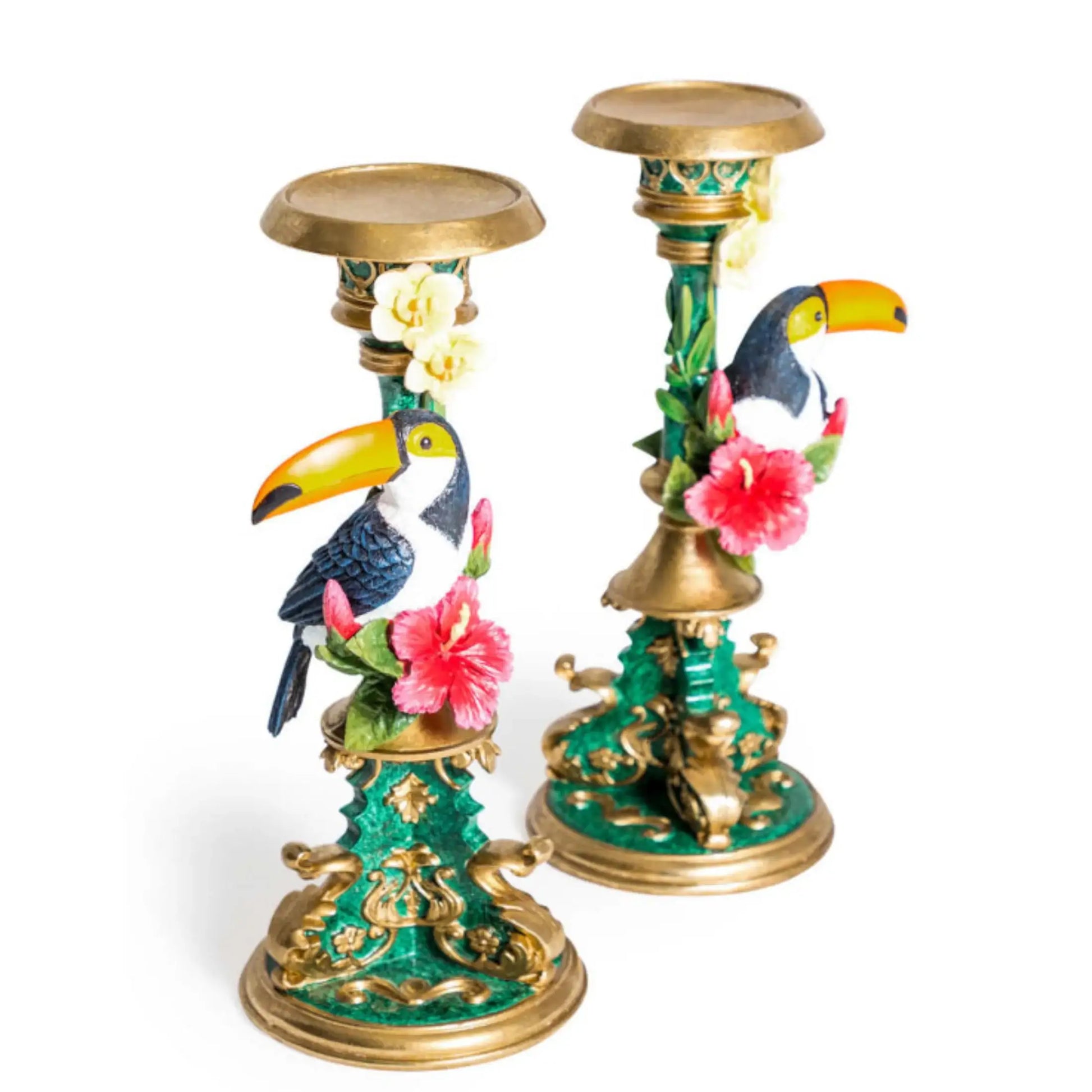Decorative candle holders with toucan and floral designs on a white background