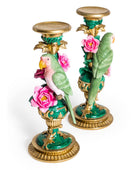 Decorative candle holders with parrot and rose design on a white background