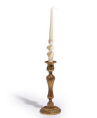 Decorative candlestick with a white candle on a white background