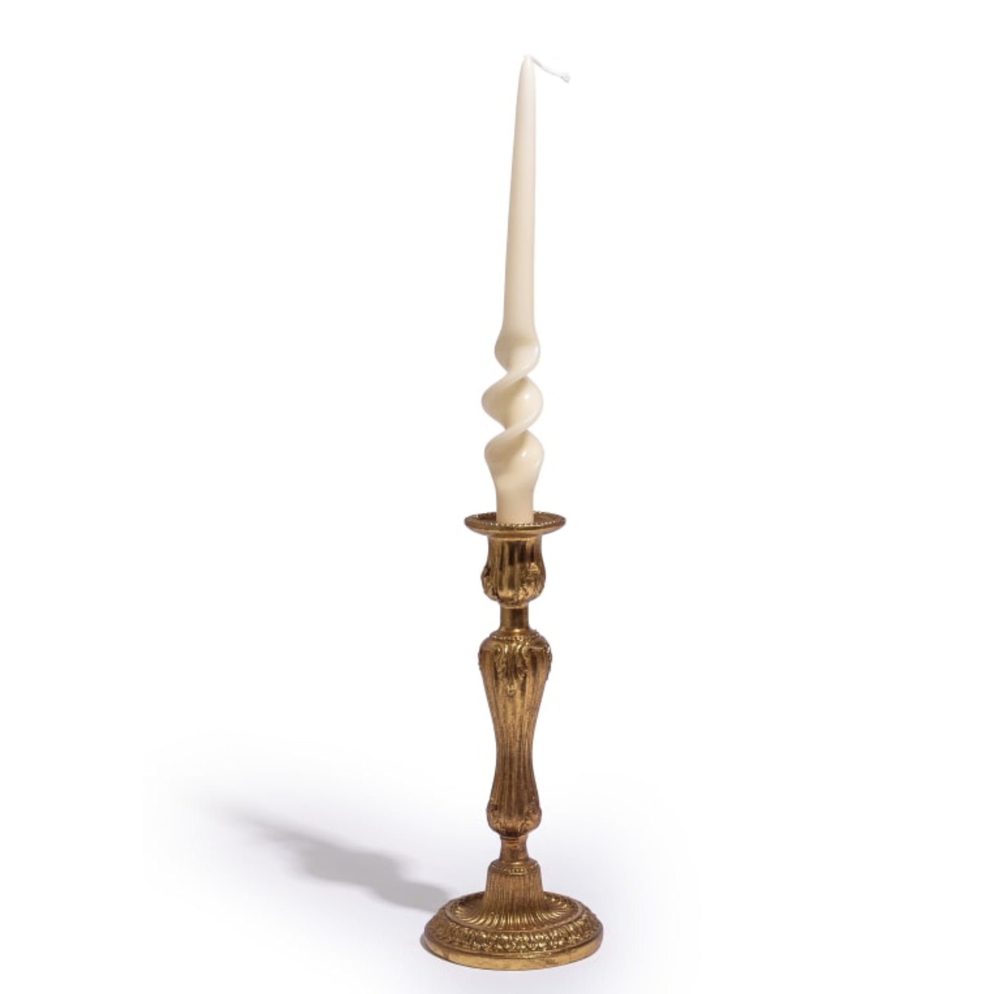 Decorative candlestick with a white candle on a white background