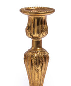 Decorative gold candle holder on a white background