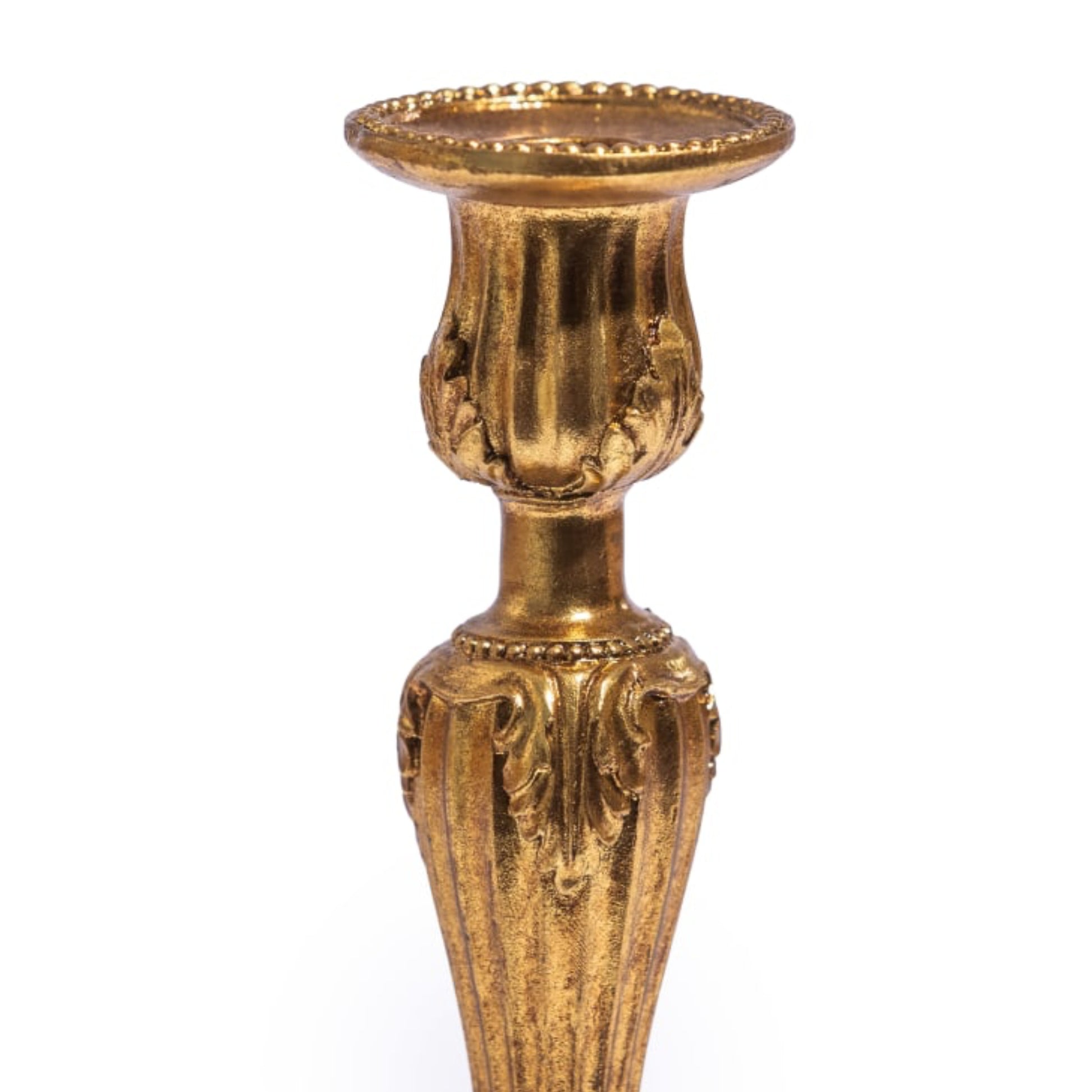 Decorative gold candle holder on a white background
