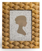 Framed silhouette with text on a textured gold background