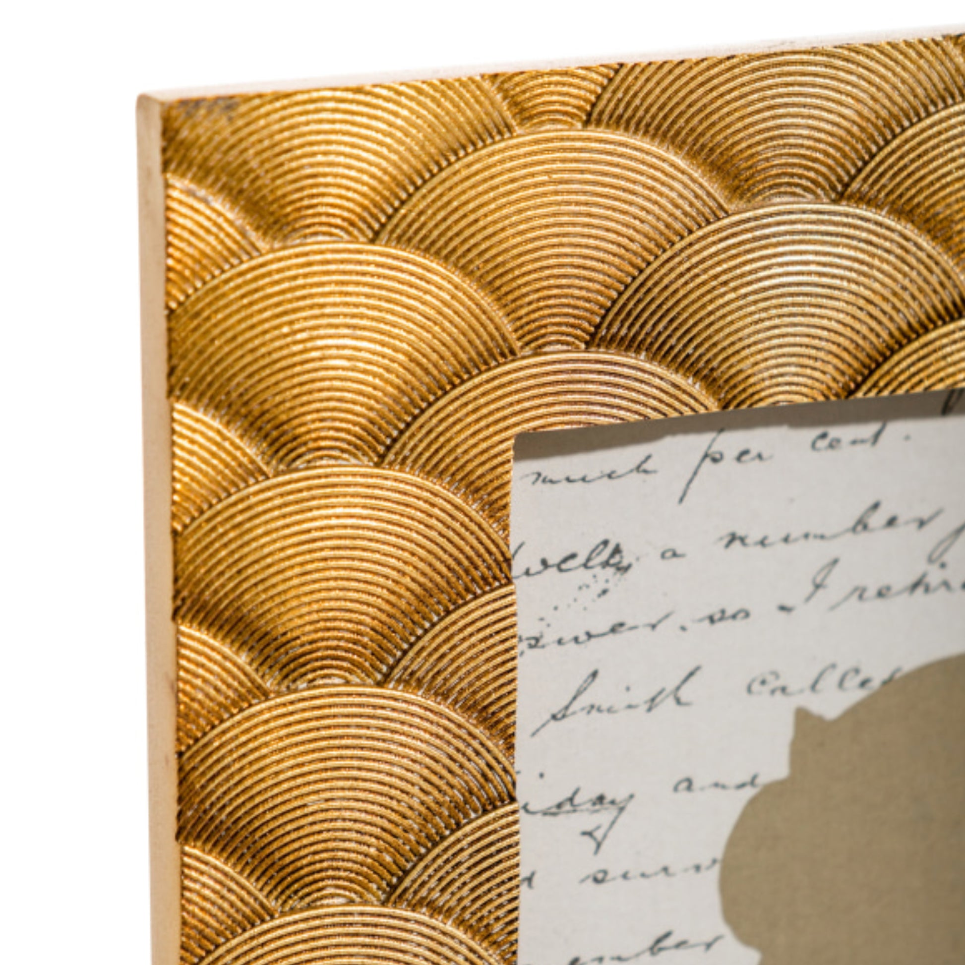 Decorative gold shell patterned frame with a piece of paper inside