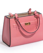 Pink handbag with black accents on a white background