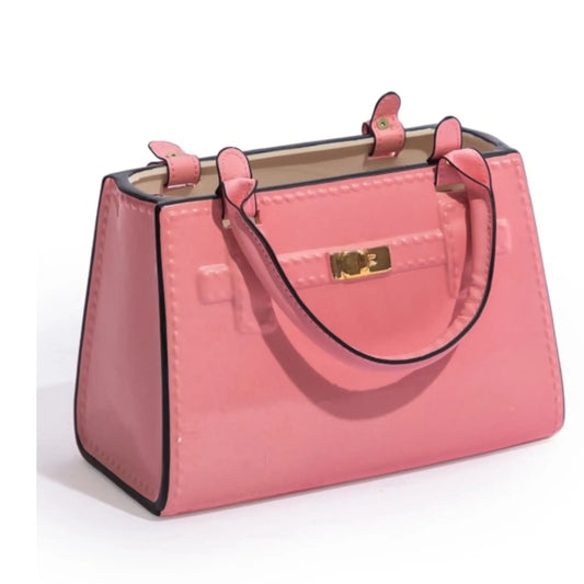 Pink handbag with black accents on a white background