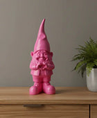 Pink gnome figurine on a white background