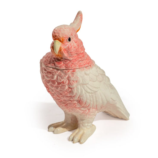 Pink and white parrot-shaped cookie jar on a white background