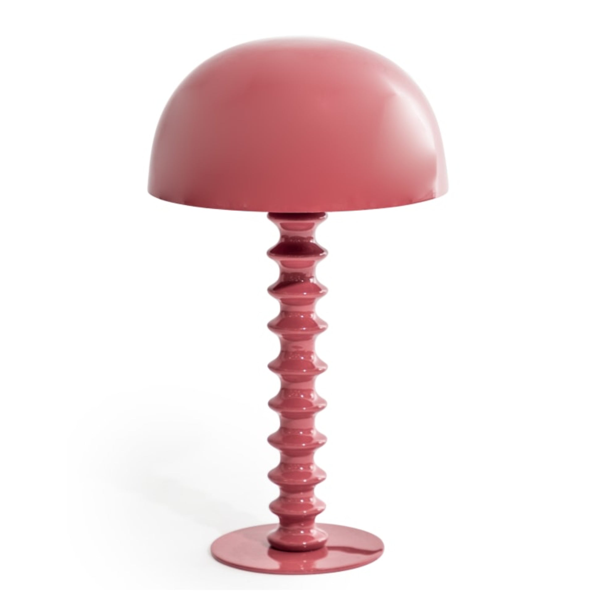 Pink table lamp with a unique base design on a white background