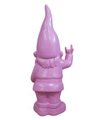 Pink garden gnome waving against a stone wall background