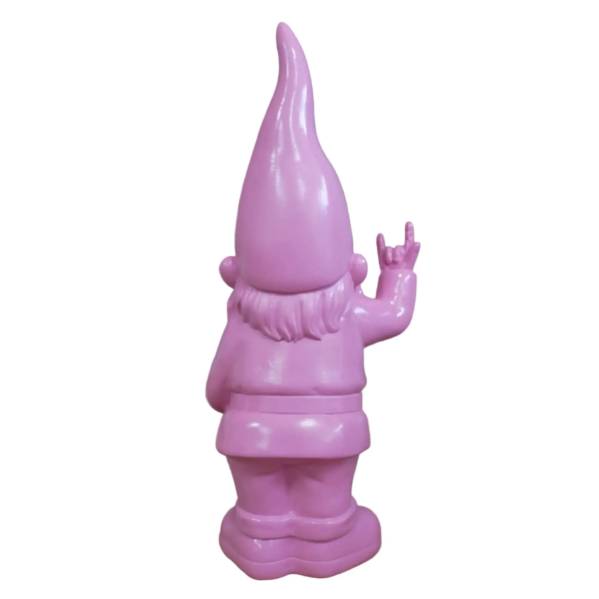 Pink garden gnome waving against a stone wall background
