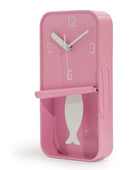 Pink wall clock with fish design on a white background
