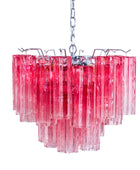 Pink chandelier with clear glass panels on a white background