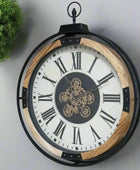 Decorative wall clock with Roman numerals and gear detail on a white background
