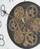 Clock with gold gears on a black face