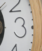 Close-up of a clock face with numbers 2, 3, and 4, and a gear mechanism.