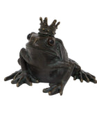 Bronze frog figurine with a crown on a white background