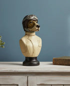 Decorative bust of a dog wearing a helmet on a wooden surface with a blue wall background.