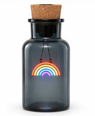 A dark gray glass bottle with a cork stopper and a black neck collar, featuring a hanging LED rainbow light inside. The bottle is centered on a clean white background.