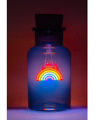 A small glass bottle with a dark stopper, glowing with blue light and featuring a colorful rainbow design in the center.