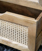 Wooden planter box with woven pattern on a dark surface