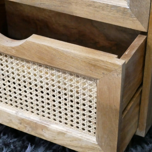 Wooden planter box with woven pattern on a dark surface