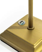 Gold-colored electronic device with a USB port on a white background
