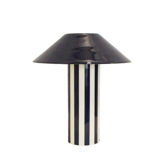 Black and white striped table lamp on a white background