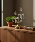 Decorative table lamp with crystal accents on a white background