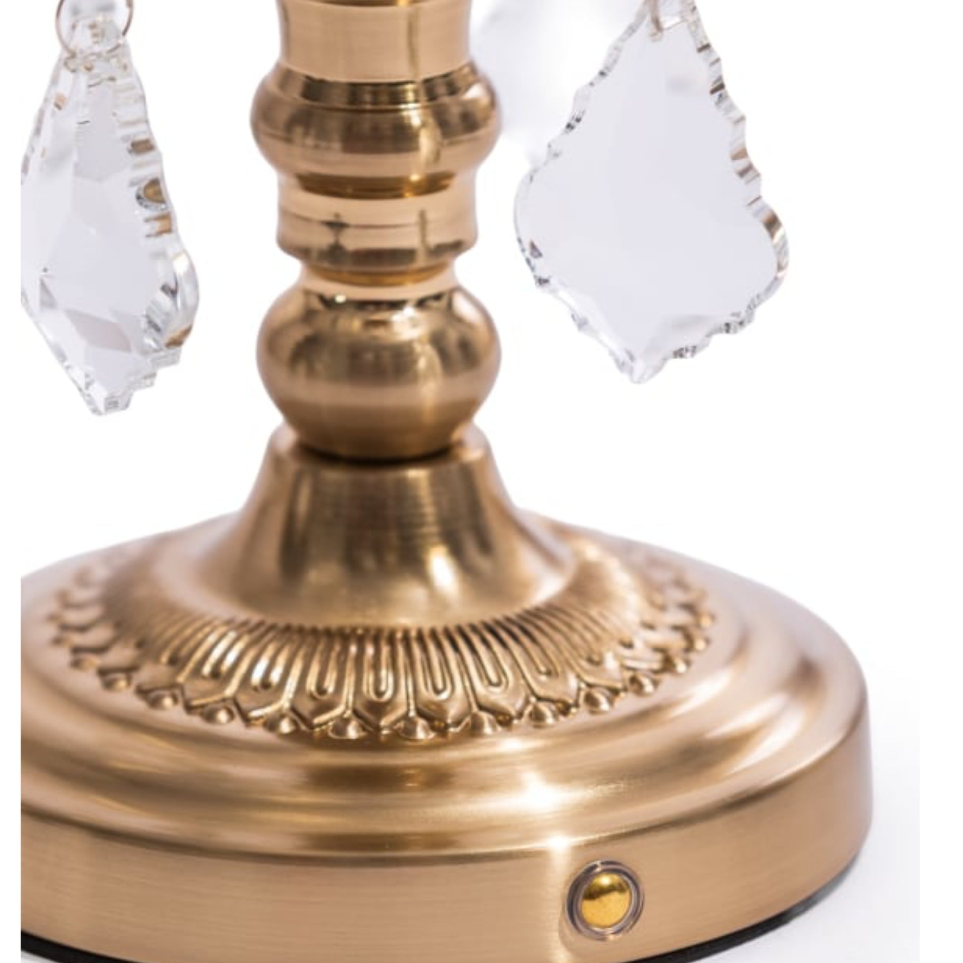 Brass candlestick with crystal accents on a white background
