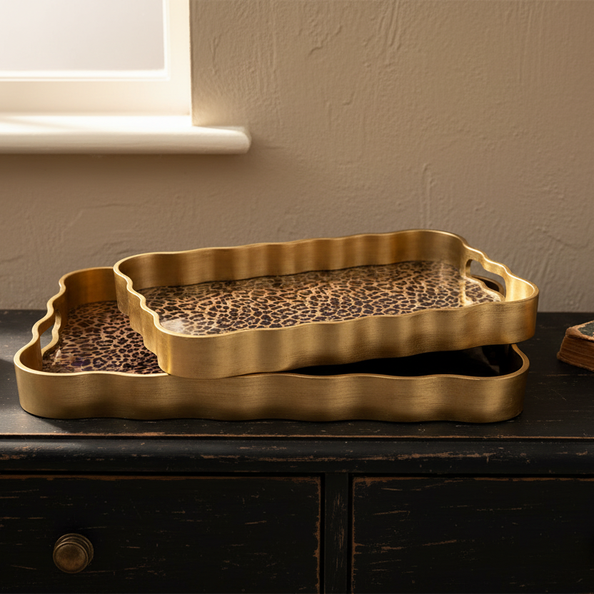 Gold tray with leopard print on a dark surface