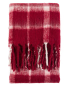 Red and white checkered throw blanket with fringes on a white background
