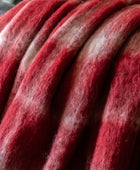 Close-up of red and gray wool fibers
