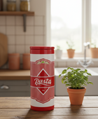 Red and white pasta container on a wooden table with a kitchen background