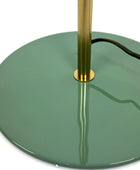 Green floor lamp with gold base on a white background