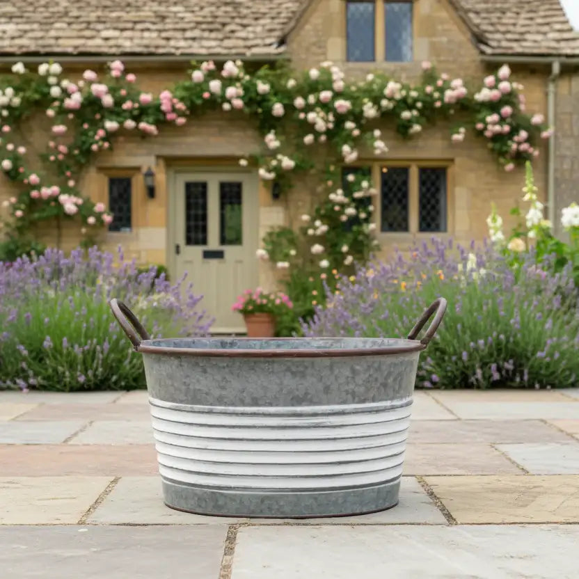 Metal tub on a patio with a garden and house in the background