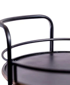 Close-up of a black metal chair with a white background