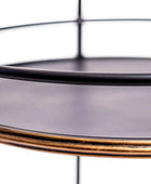 Round glass tray with gold rim on a white background