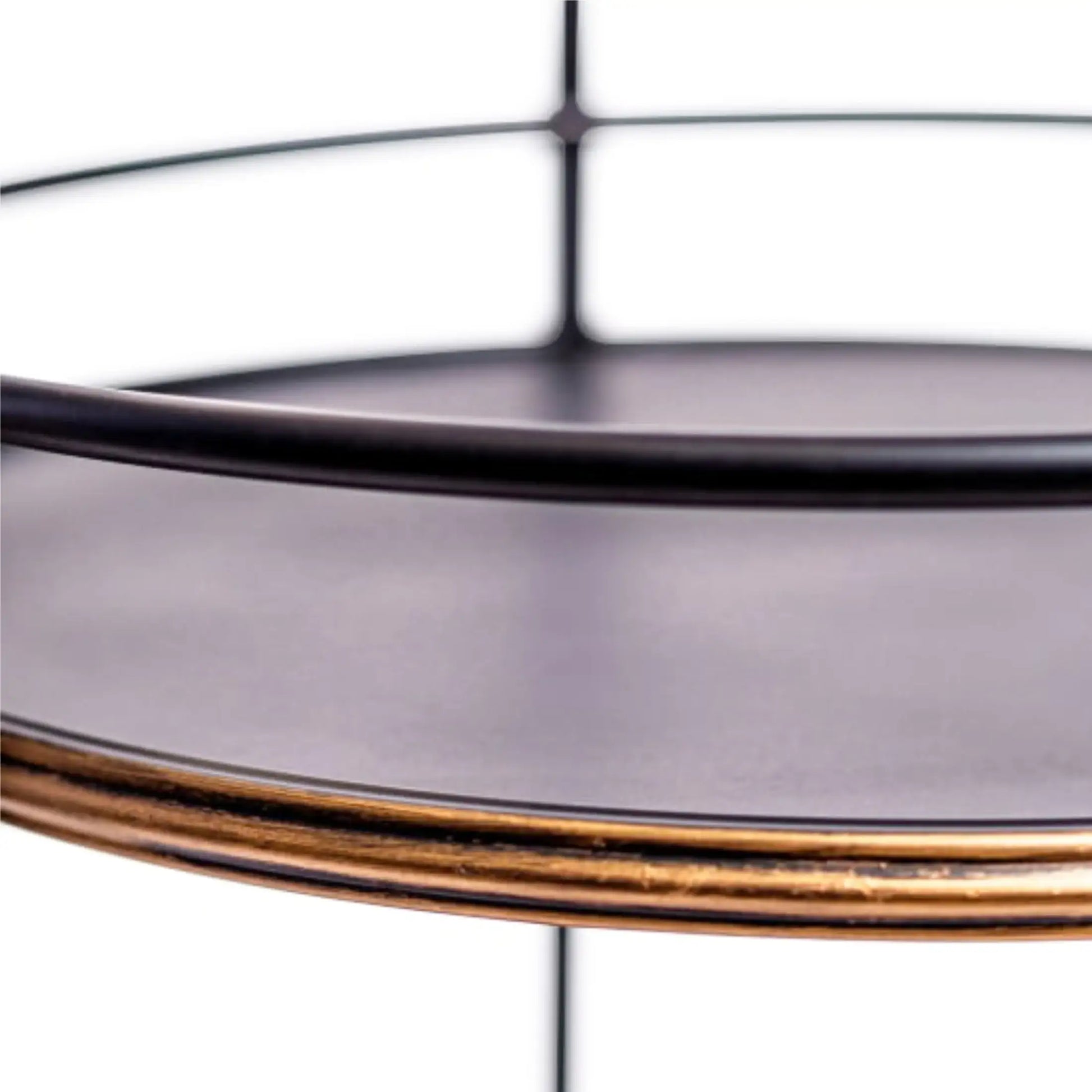 Round glass tray with gold rim on a white background